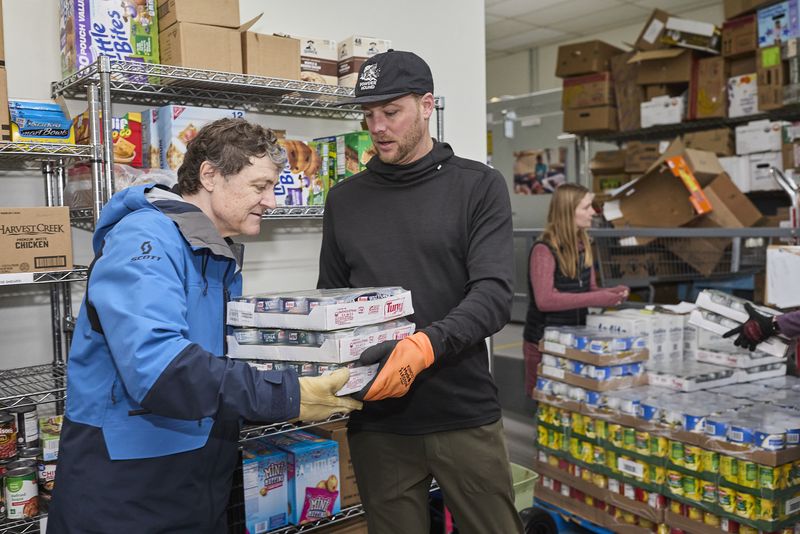 Volunteers stocking shelves at the Gunnison Country Food Pantry
